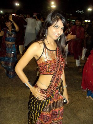 18 year old female Doris G slips off her underwear to pose naked on her bed